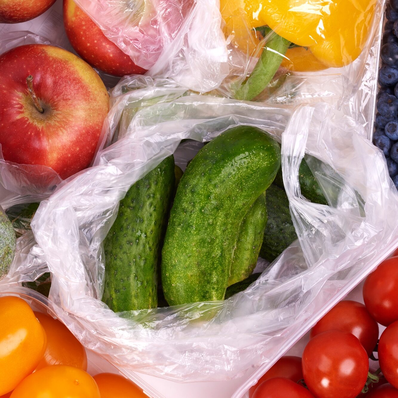 Plastic bags of fruits and vegetables
